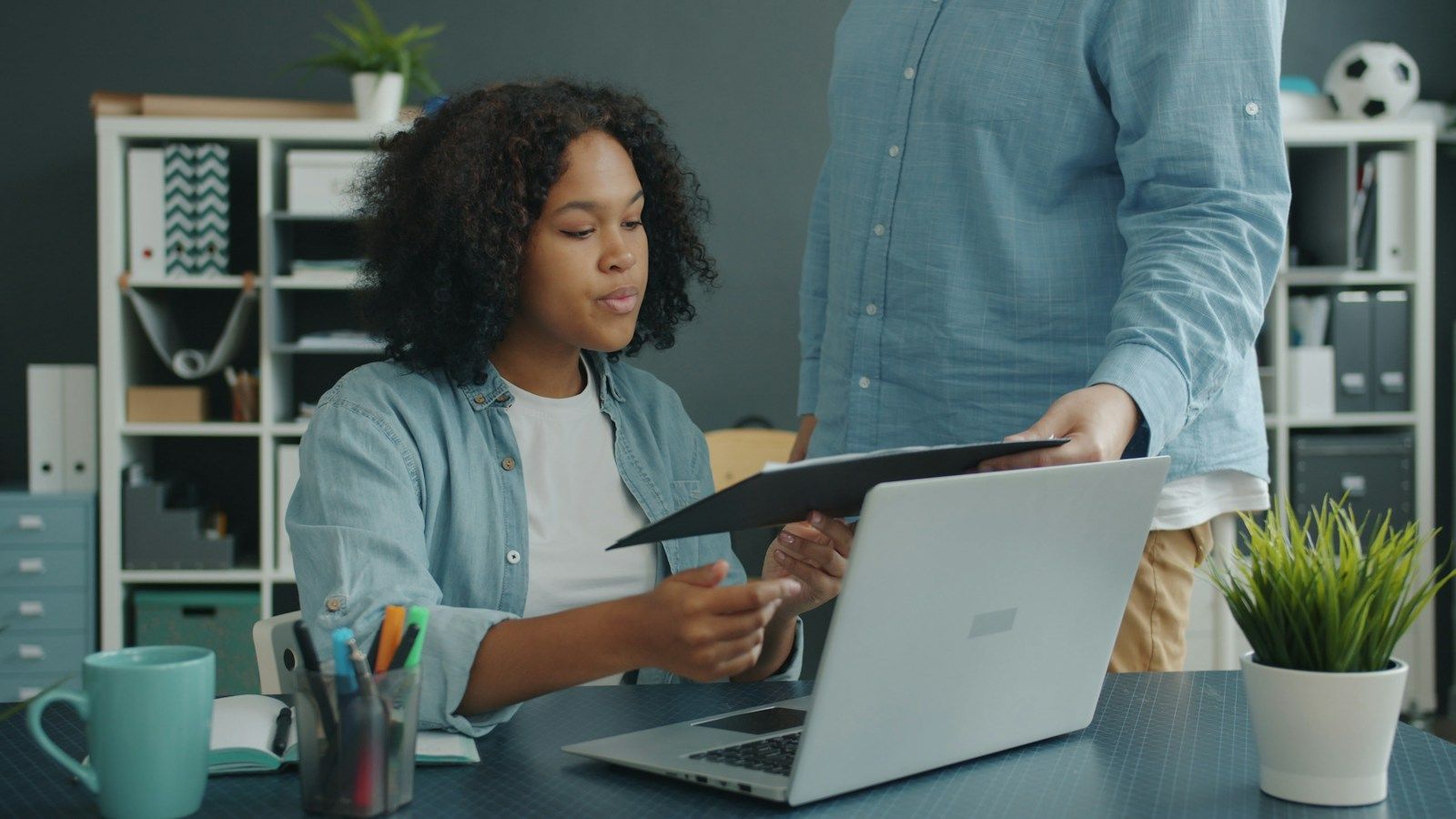 Client reviewing mortgage documents with an advisor at a desk